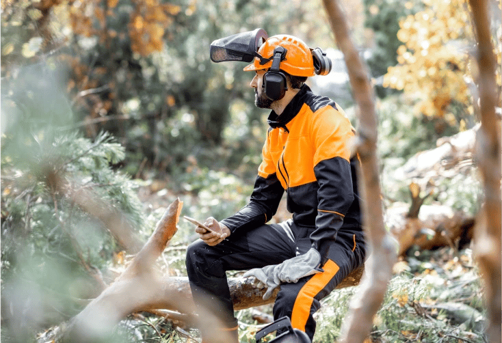 worker sitting in the woods 